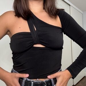 Black asymmetric top with cut outs.